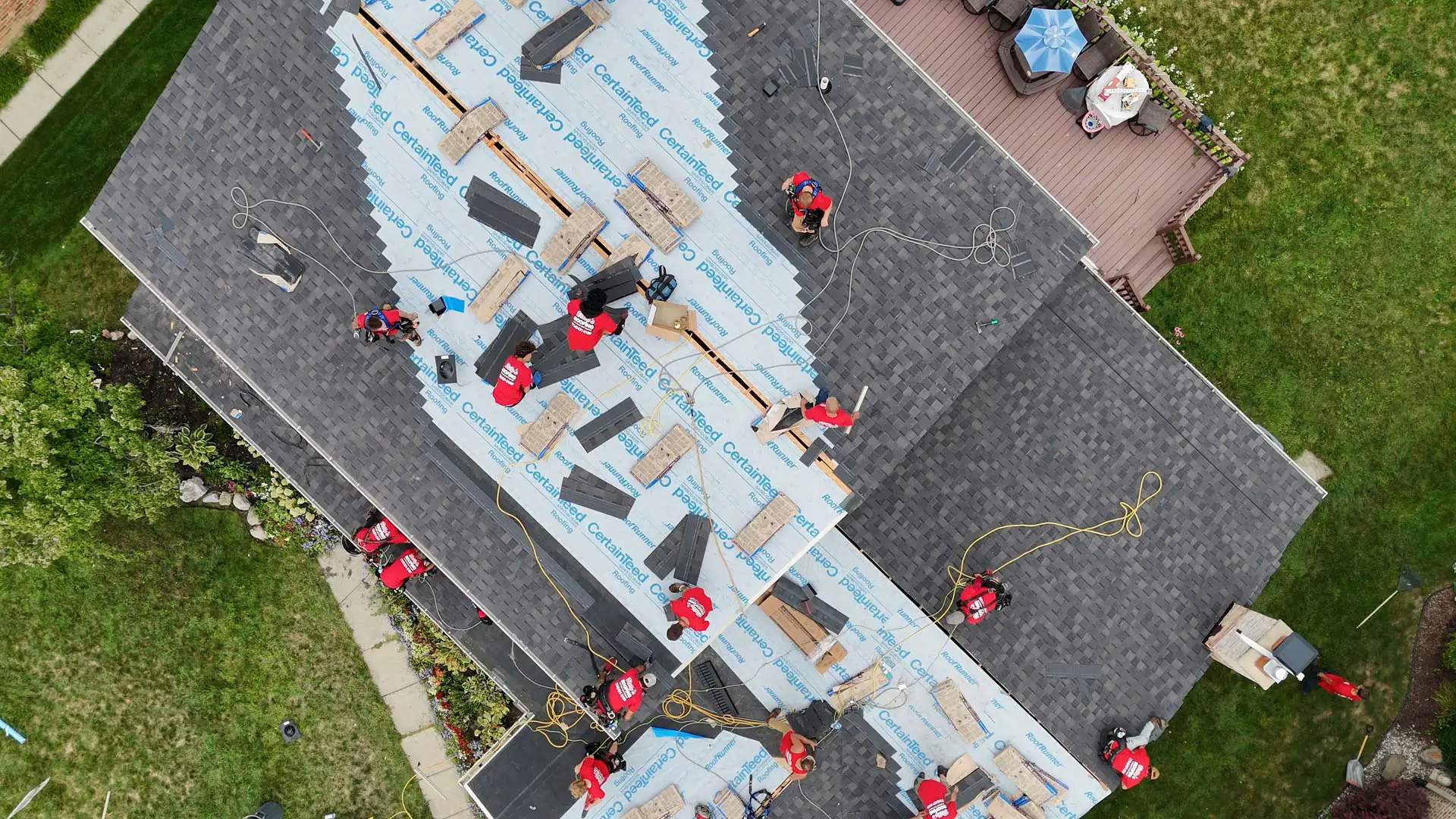 Aerial view of Billy's Roofing team working on a roof replacement in Metro Detroit.