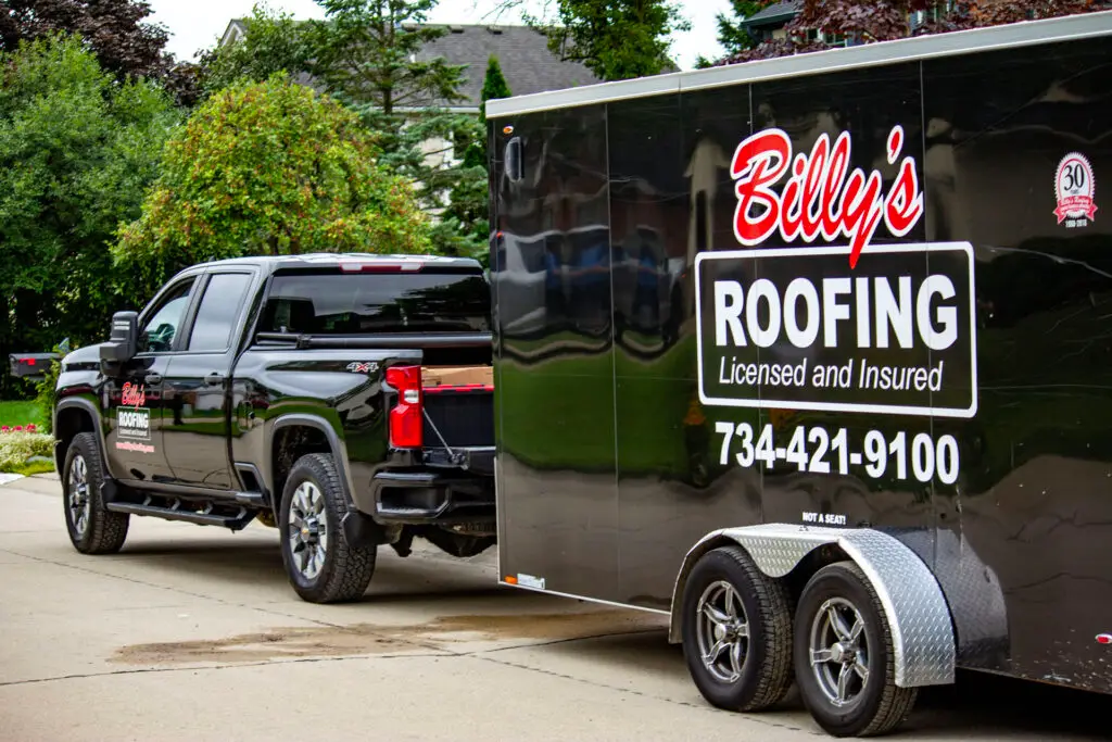 Billy's Roofing company truck and trailer.