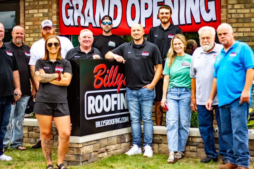 The Billy's Roofing family in front of their new Plymouth location showroom.