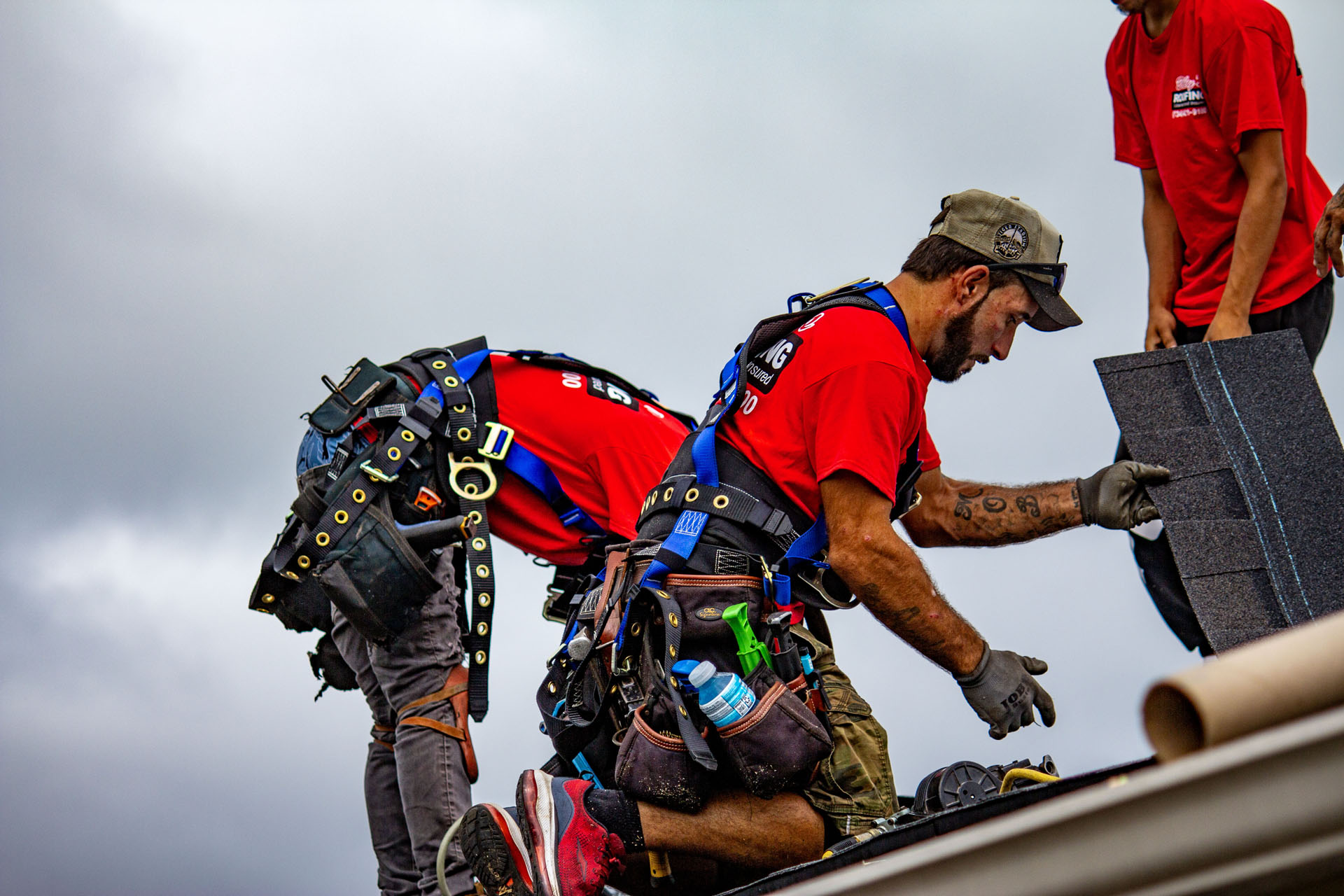 Billy’s Roofing crew installing asphalt shingles on residential roof in Metro Detroit