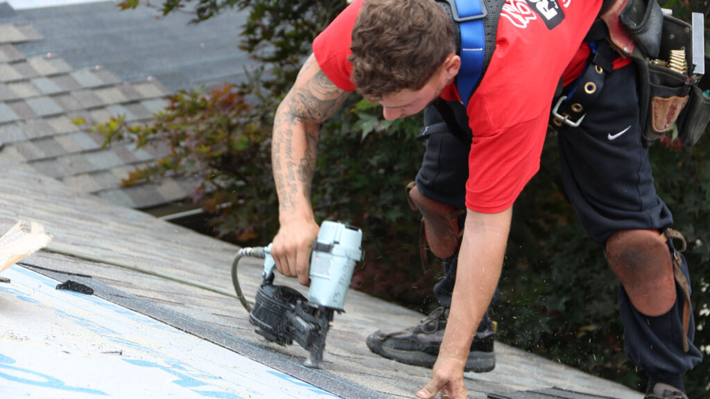 Billy’s Roofing Urges Plymouth Homeowners to Check September Storm Damage Before Winter 2 A Billy’s Roofing crew member installs replacement shingles during a residential roof repair project.